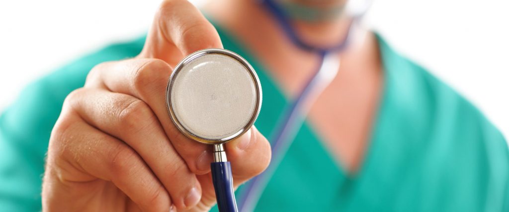 Doctor holding stethoscope (with shallow depth of field)